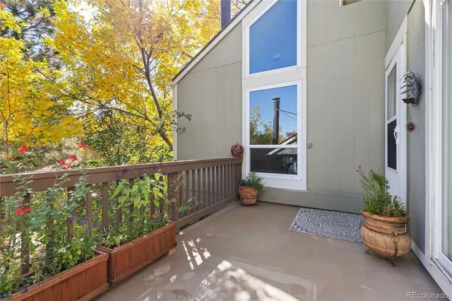 a view of balcony with furniture