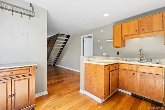 a bathroom with a sink a mirror and a shower