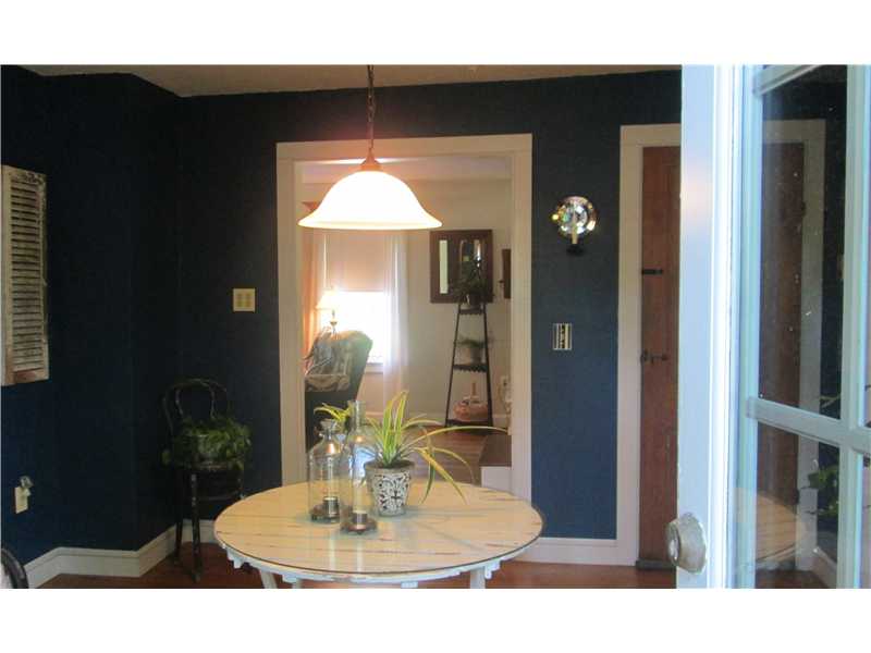 587 Ten Rod Road North Kingstown, RI 02852 - Photo 11 of 20 Dining Room. A view of the Dining Room towards the Living Room from the French doors.