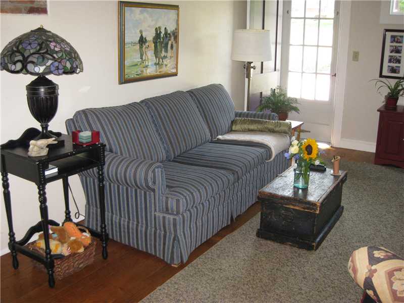 587 Ten Rod Road North Kingstown, RI 02852 - Photo 4 of 20 Living Room. A cheery Living Room with gleaming wide plank pine floors.