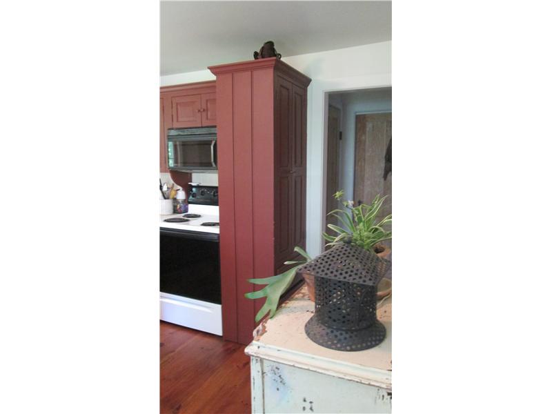 587 Ten Rod Road North Kingstown, RI 02852 - Photo 8 of 20 Kitchen. Photo shows kitchen pantry and walk-in closet in hallway,