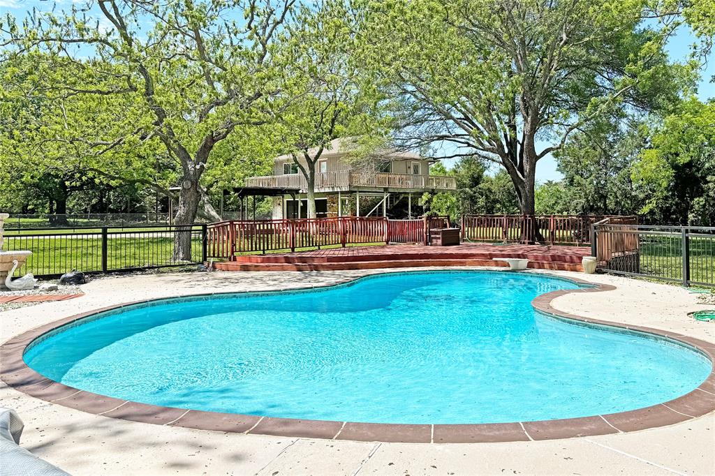 a view of a swimming pool with a patio