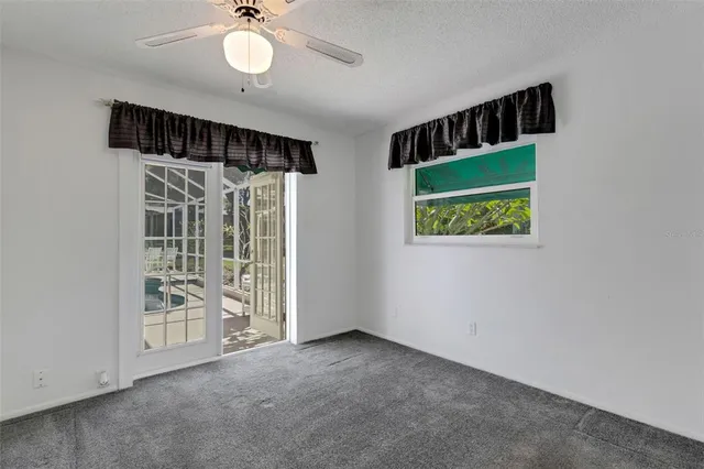 a view of a backyard with sitting area
