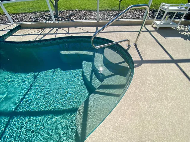 an aerial view of residential house with outdoor space and street view