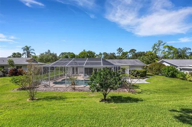 a view of a house with a swimming pool and outdoor space