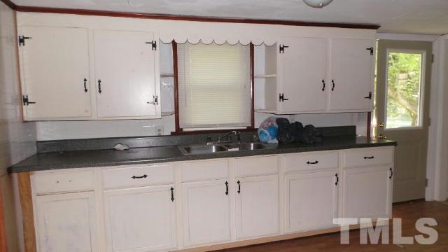 2841 Us 158 Roxboro, NC 27574 - Photo 4 of 6 a bathroom with a sink and a mirror