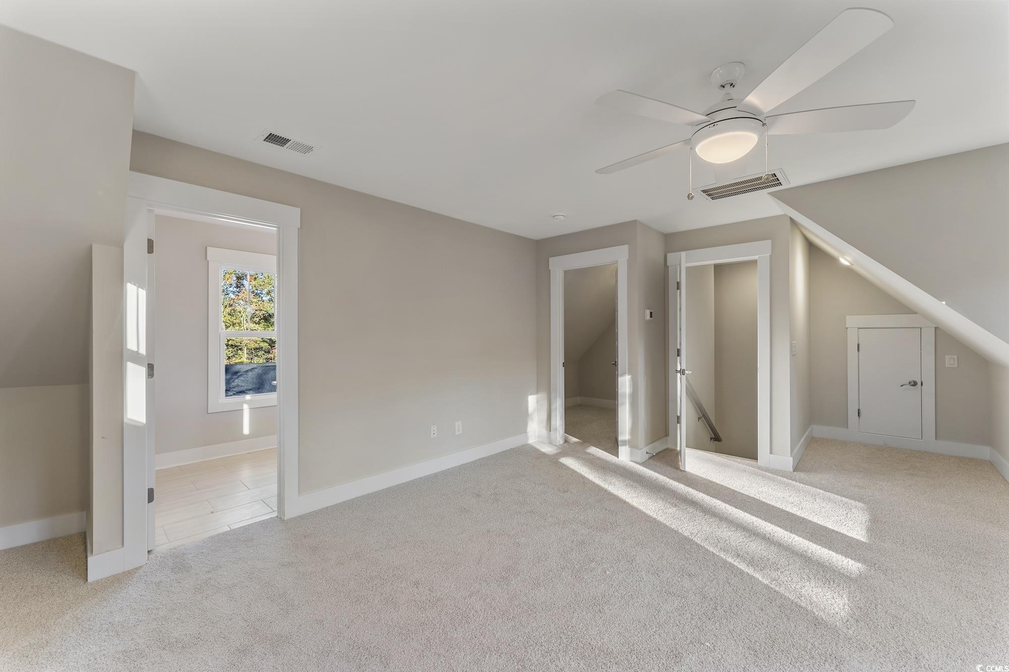 719 Daisy Bank Circle Georgetown, SC 29440 - Photo 27 of 33 Bonus room with light carpet and a ceiling fan