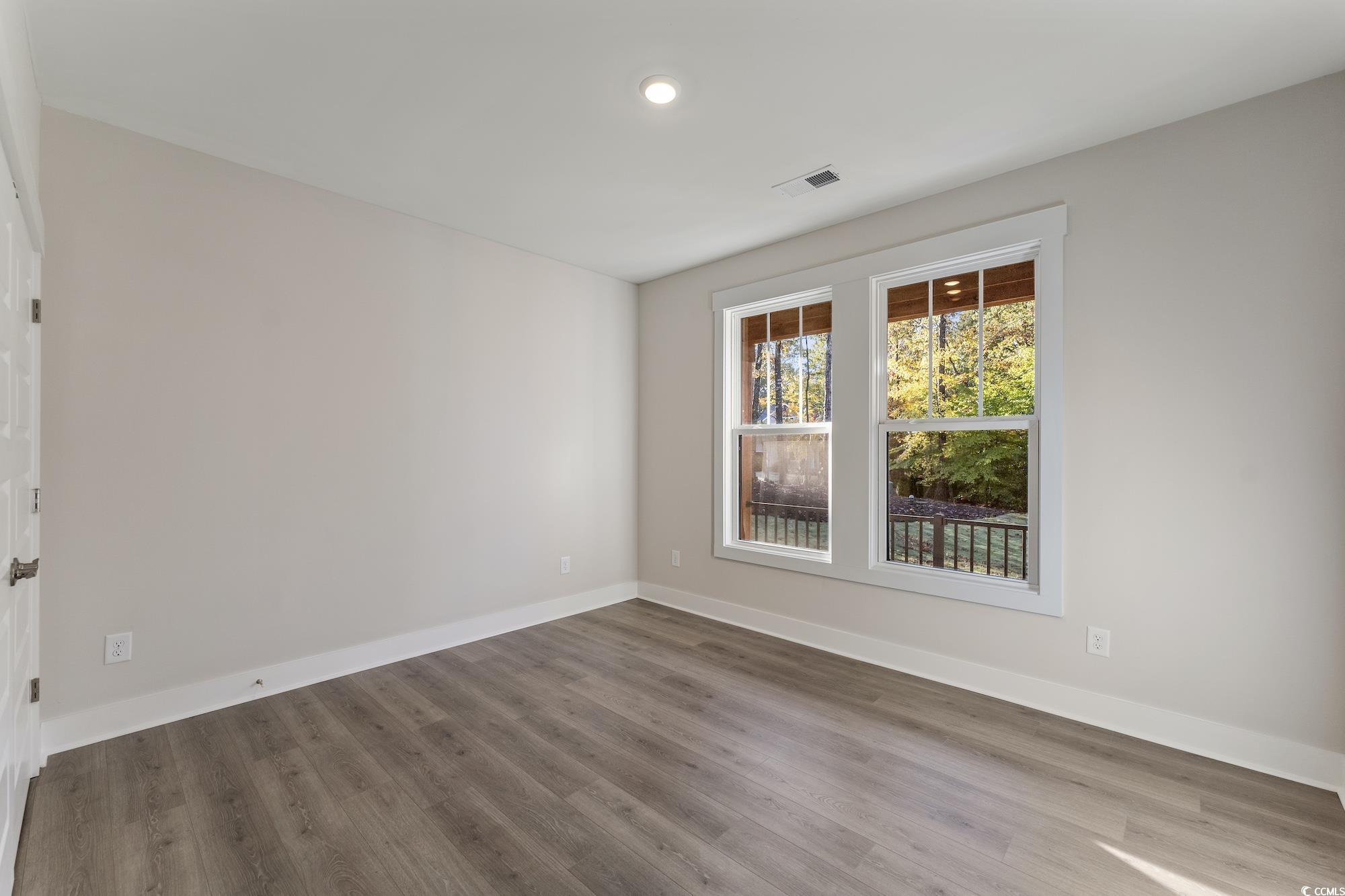 719 Daisy Bank Circle Georgetown, SC 29440 - Photo 29 of 33 Unfurnished room with light wood-style flooring and baseboards