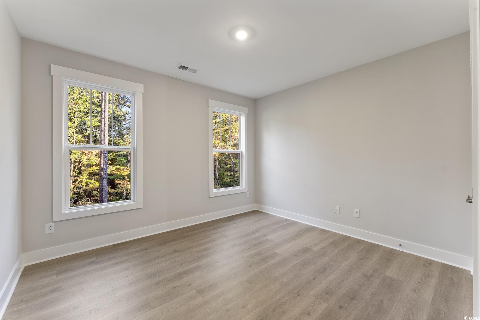 719 Daisy Bank Circle Georgetown, SC 29440 - Photo 32 of 33 Unfurnished room with baseboards and light wood finished floors