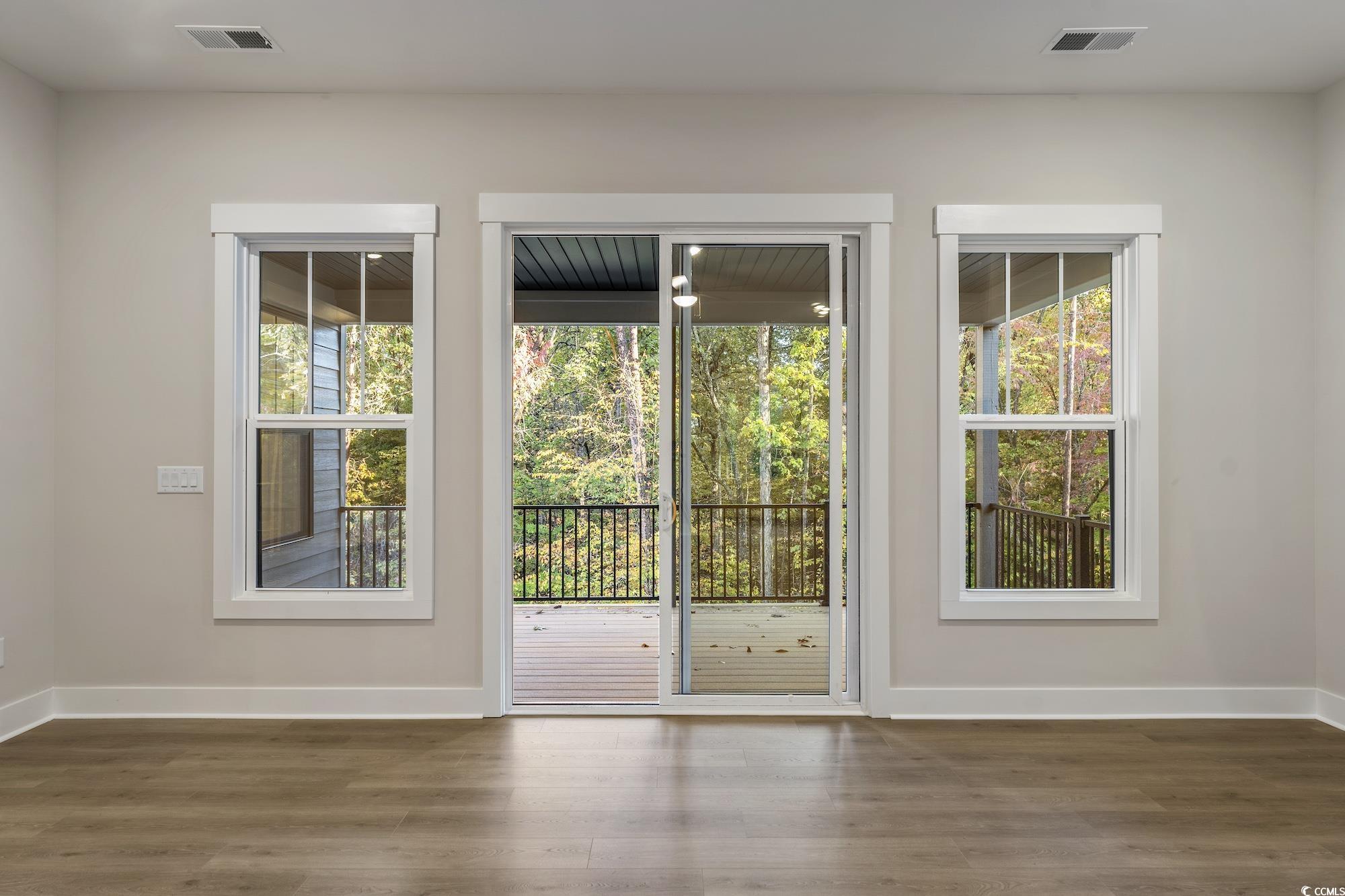 719 Daisy Bank Circle Georgetown, SC 29440 - Photo 8 of 33 Entryway featuring healthy amount of natural light and wood finished floors