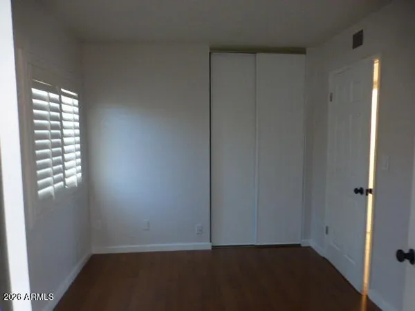 a view of empty room with windows