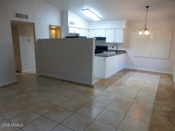 a view of a kitchen with a sink