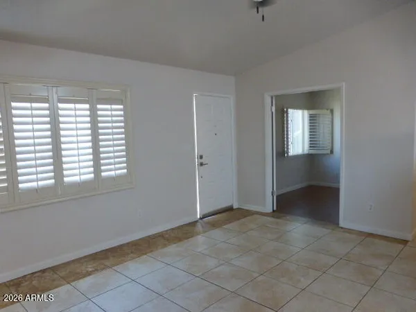 a open kitchen with kitchen island granite countertop a refrigerator a sink and a stove