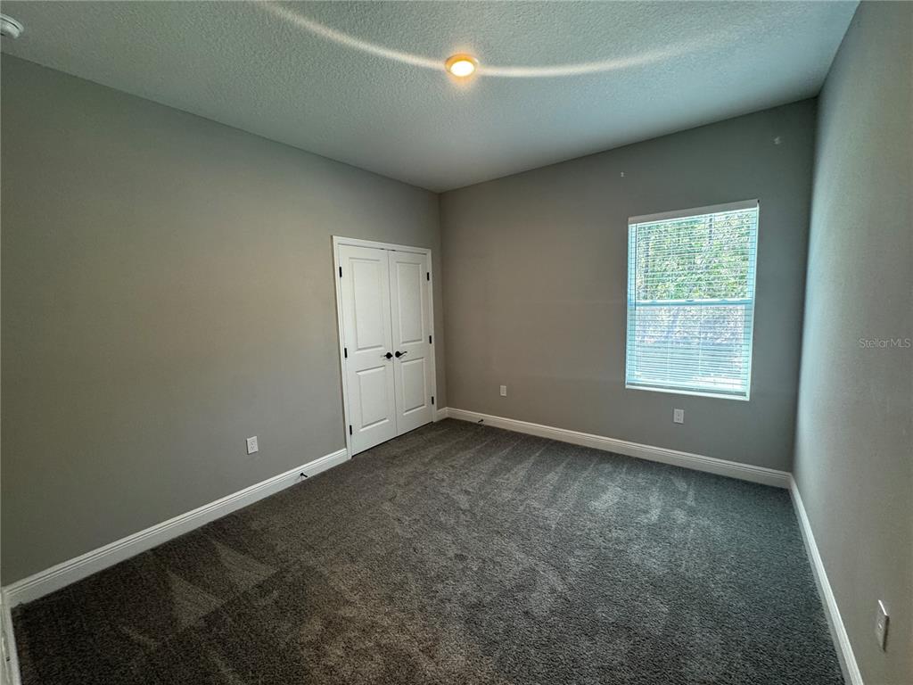 13101 Southwest 72nd Terrace Road Ocala, FL 34473 - Photo 10 of 18 an empty room with a window