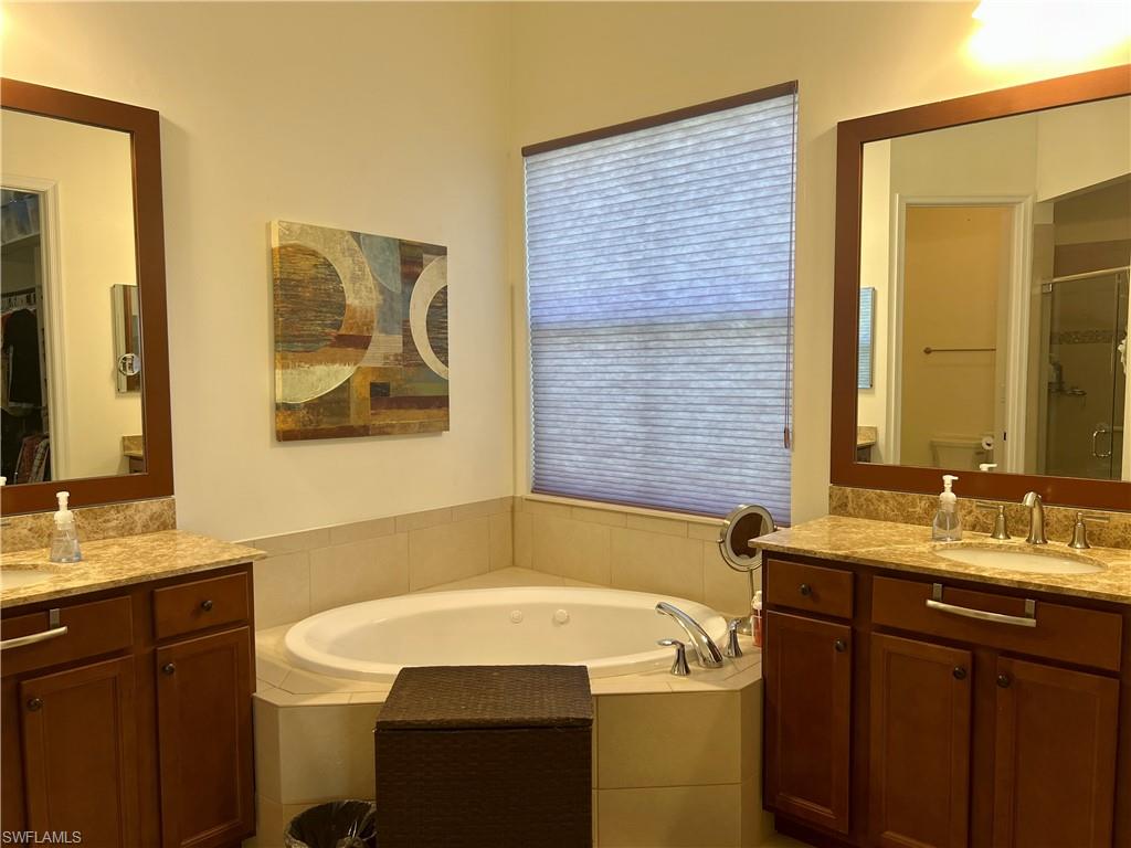 5351 Ferrari Avenue Ave Maria, FL 34142 - Photo 12 of 24 a bathroom with a sink and a mirror