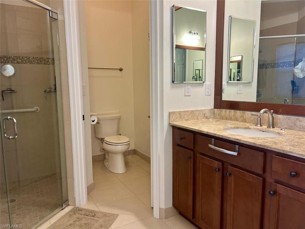 5351 Ferrari Avenue Ave Maria, FL 34142 - Photo 13 of 24 a spacious bathroom with a granite countertop sink toilet and shower