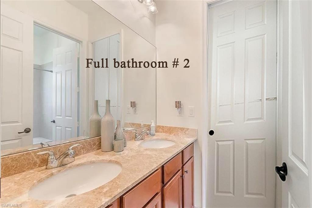 5351 Ferrari Avenue Ave Maria, FL 34142 - Photo 14 of 24 a bathroom with a granite countertop sink and a mirror