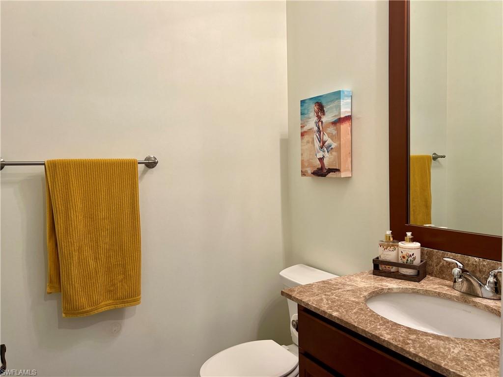5351 Ferrari Avenue Ave Maria, FL 34142 - Photo 15 of 24 a bathroom with a granite countertop sink and a mirror