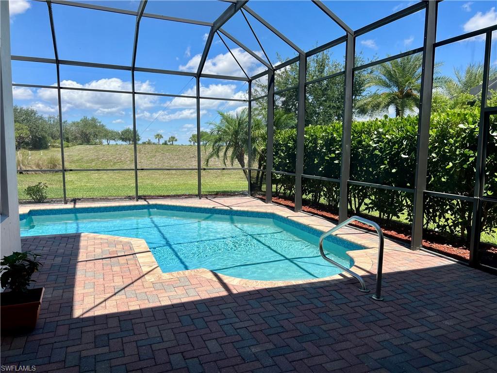 5351 Ferrari Avenue Ave Maria, FL 34142 - Photo 19 of 24 a view of a tennis ground with a large window