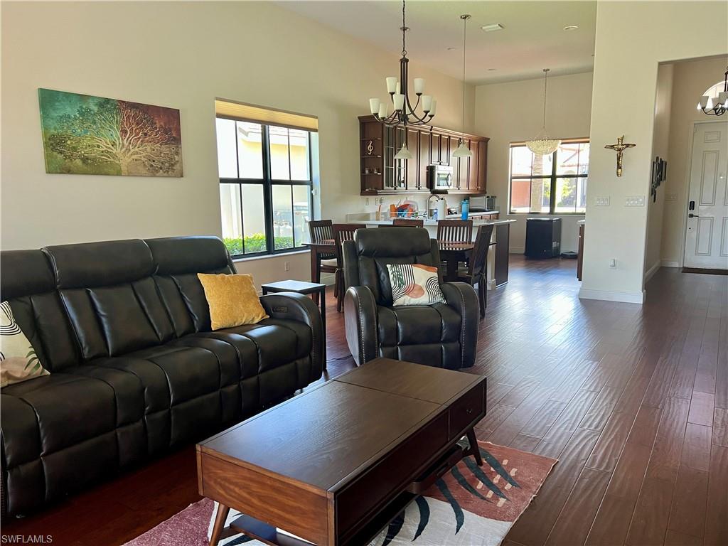 5351 Ferrari Avenue Ave Maria, FL 34142 - Photo 6 of 24 a living room with furniture a dining table and a large window