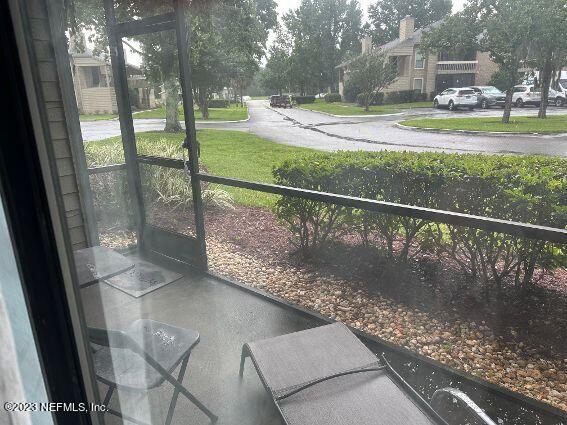 10200 Belle Rive Boulevard, Unit 239 Jacksonville, FL 32256 - Photo 12 of 27 a view of swimming pool from a porch