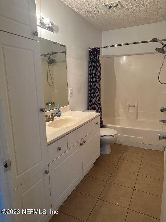 10200 Belle Rive Boulevard, Unit 239 Jacksonville, FL 32256 - Photo 13 of 27 a bathroom with a granite countertop sink a toilet and shower