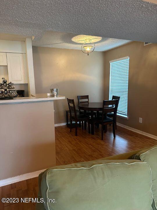10200 Belle Rive Boulevard, Unit 239 Jacksonville, FL 32256 - Photo 16 of 27 a view of a dining room with furniture