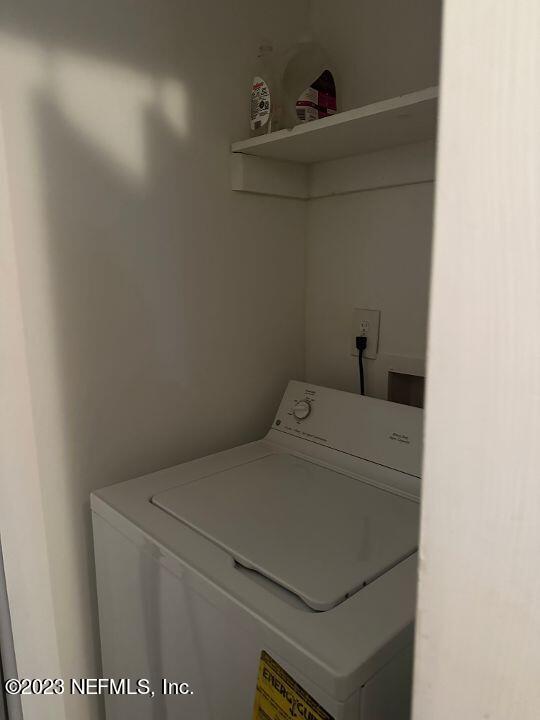 10200 Belle Rive Boulevard, Unit 239 Jacksonville, FL 32256 - Photo 18 of 27 a utility room with dryer and washer
