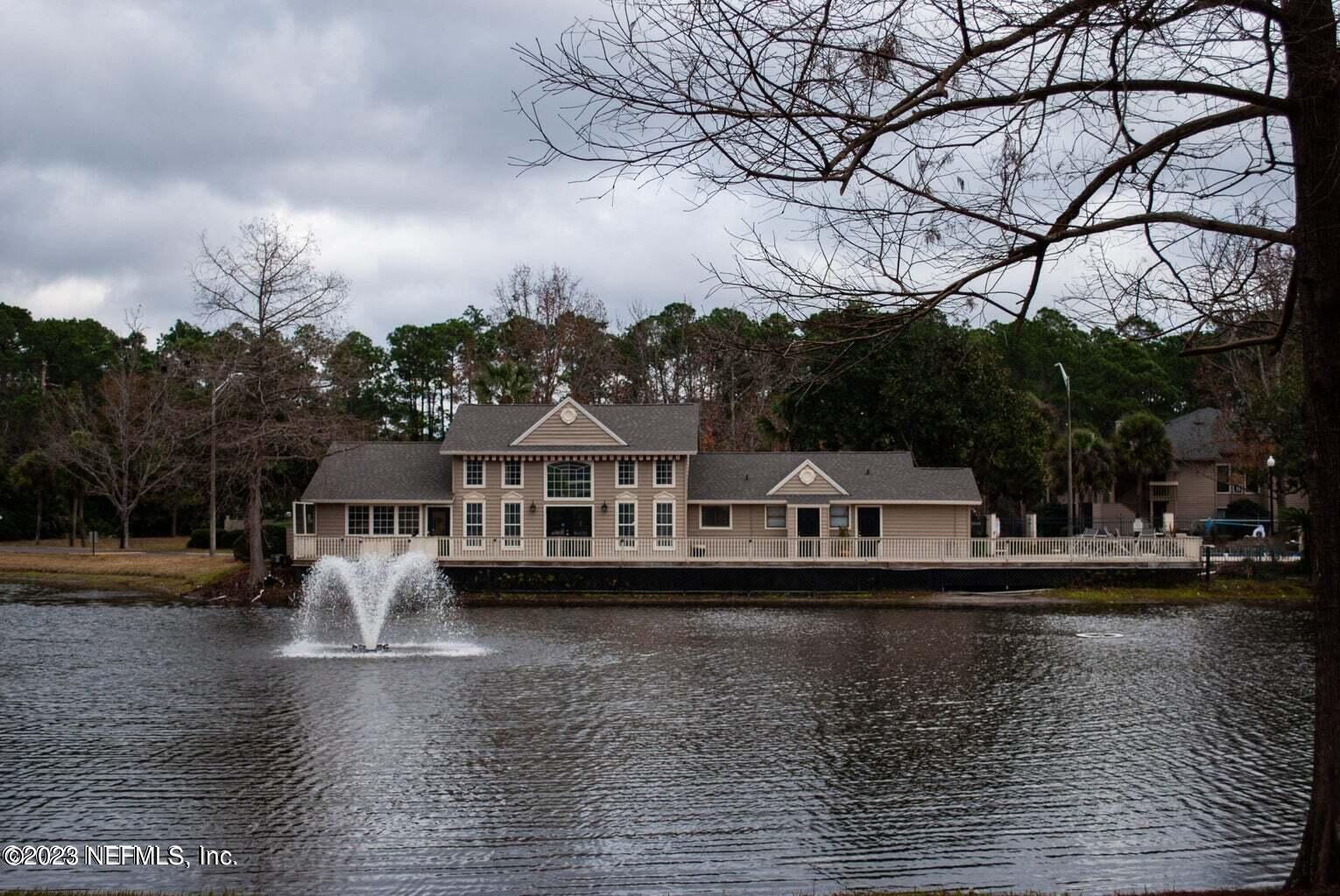 10200 Belle Rive Boulevard, Unit 239 Jacksonville, FL 32256 - Photo 22 of 27 a view of a lake with houses