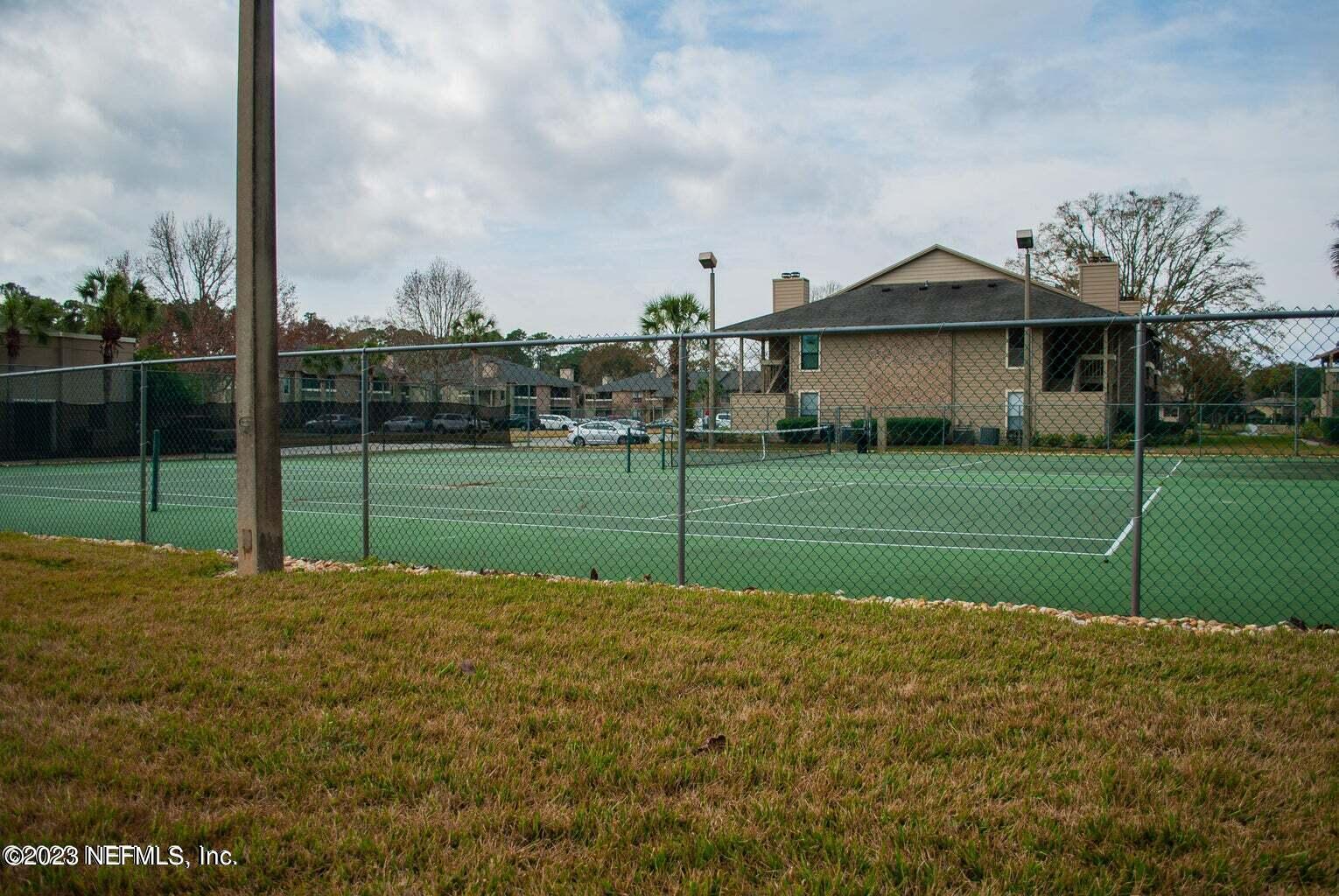 10200 Belle Rive Boulevard, Unit 239 Jacksonville, FL 32256 - Photo 26 of 27 a view of a volley ball court