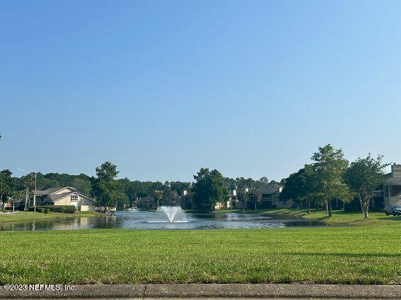 10200 Belle Rive Boulevard, Unit 239 Jacksonville, FL 32256 - Photo 6 of 27 a view of a golf course with a lake