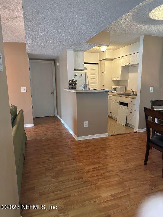 10200 Belle Rive Boulevard, Unit 239 Jacksonville, FL 32256 - Photo 7 of 27 a view of a kitchen with wooden floor