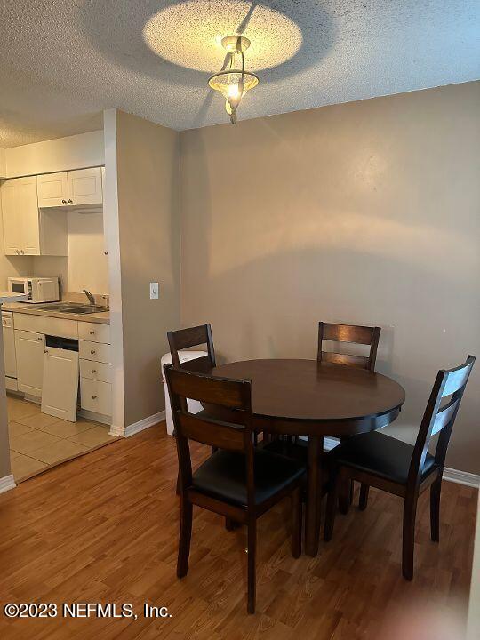 10200 Belle Rive Boulevard, Unit 239 Jacksonville, FL 32256 - Photo 8 of 27 a view of a dining room with furniture