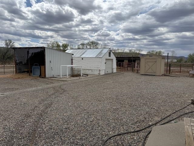 851 21 Road Fruita, CO 81521 - Photo 10 of 17 a view of a barn with wooden fence