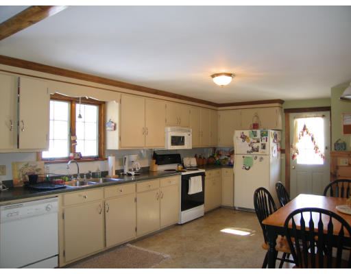 43 Bethany Road Monson, MA 01057 - Photo 11 of 16 a kitchen with granite countertop a sink stove and cabinets