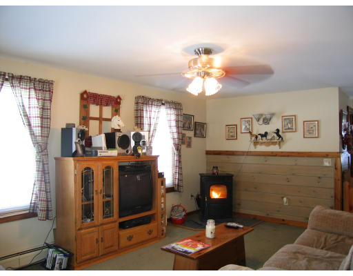43 Bethany Road Monson, MA 01057 - Photo 8 of 16 a living room with furniture and a fireplace