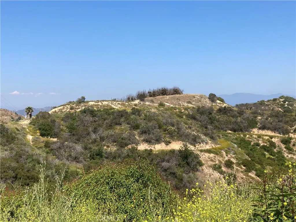6 Crumley Court Temecula, CA 92590 - Photo 6 of 11 a view of a large building with mountains in the background