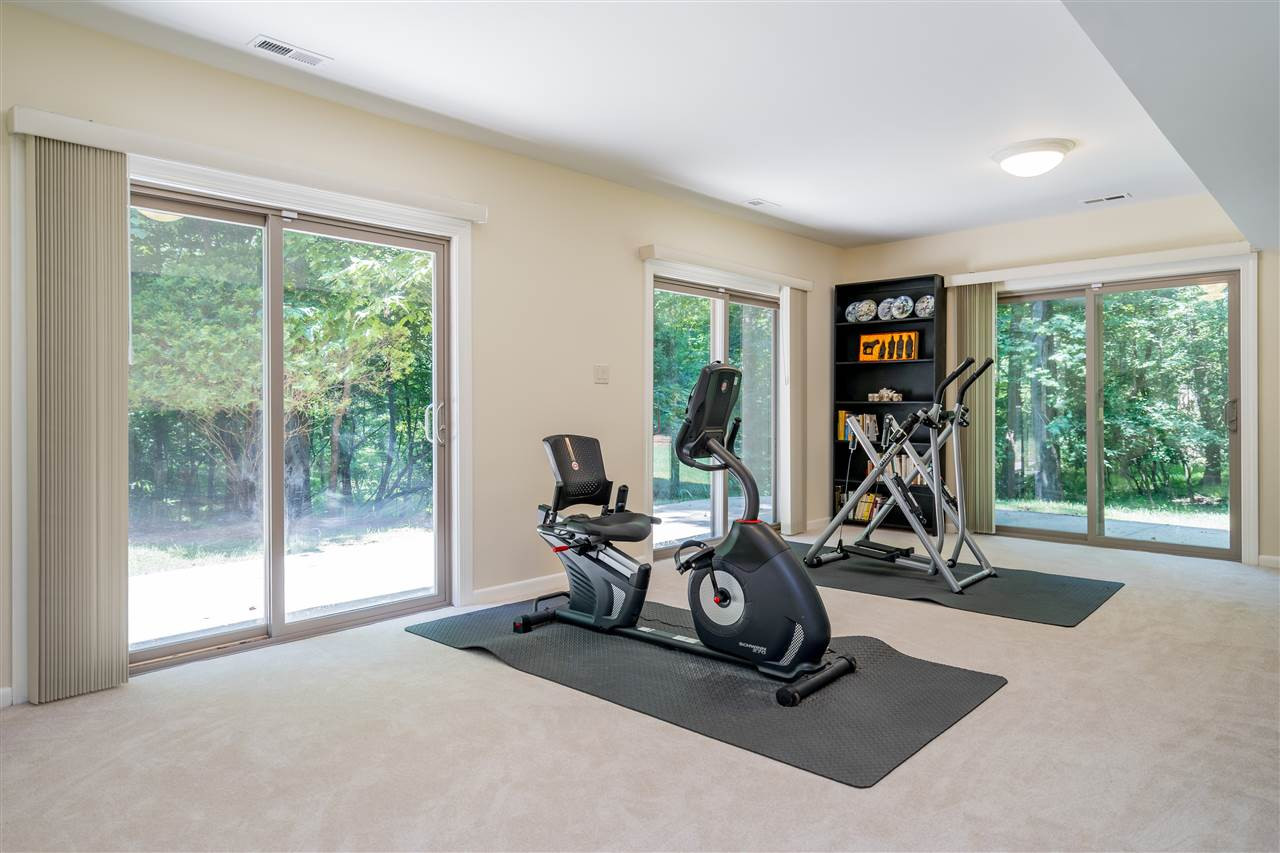 2108 Countrywood Road North Raleigh, NC 27615 - Photo 25 of 30 Daylight recreatiion room with exits to outoor patios. Fresh new carpeting and space for multiple purposes. Recreation Room