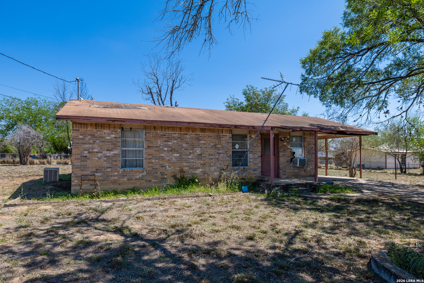 354 6th Poteet, TX 78065 - Photo 4 of 11 a front view of a house with a yard