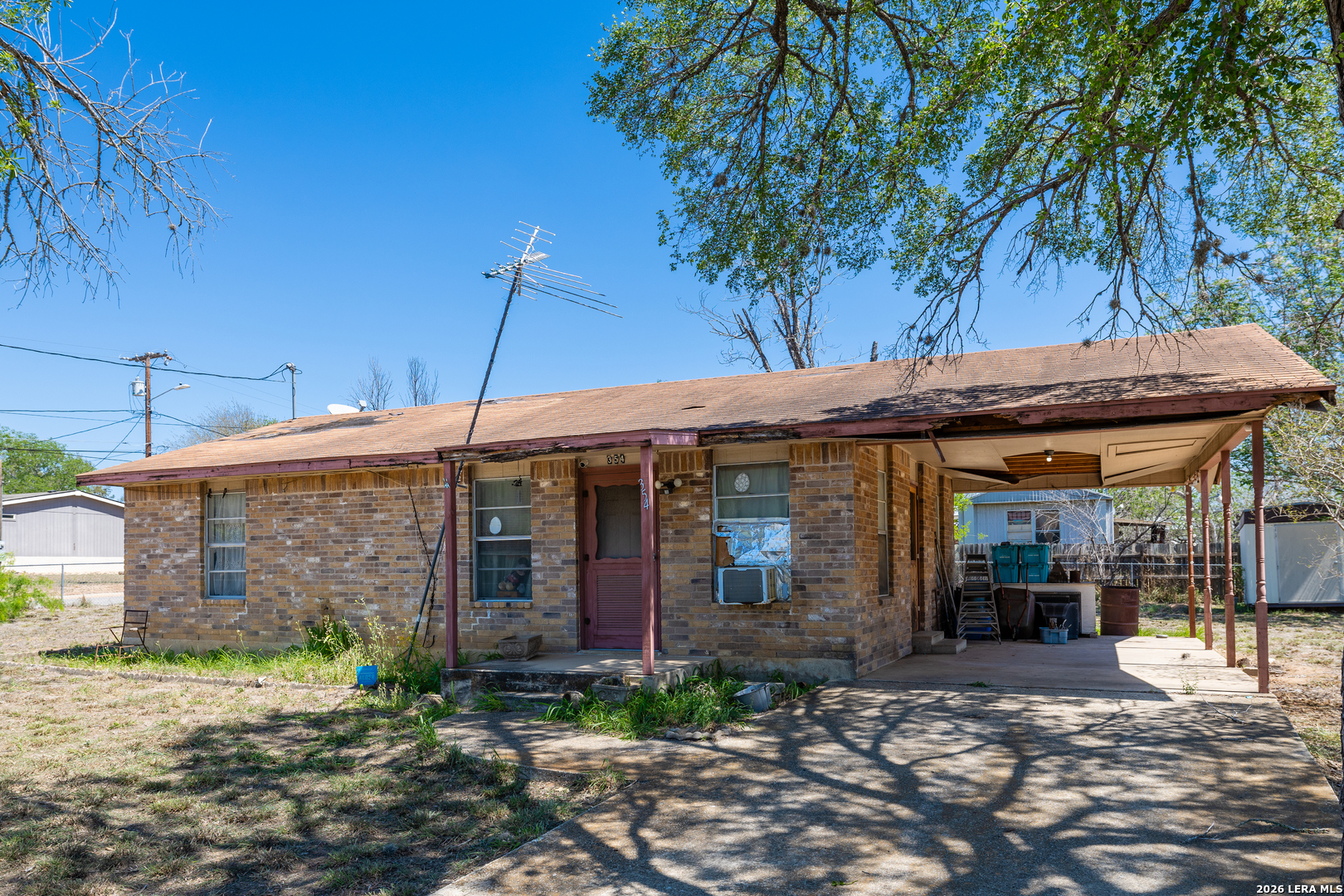 354 6th Poteet, TX 78065 - Photo 5 of 11 a view of a house with a patio