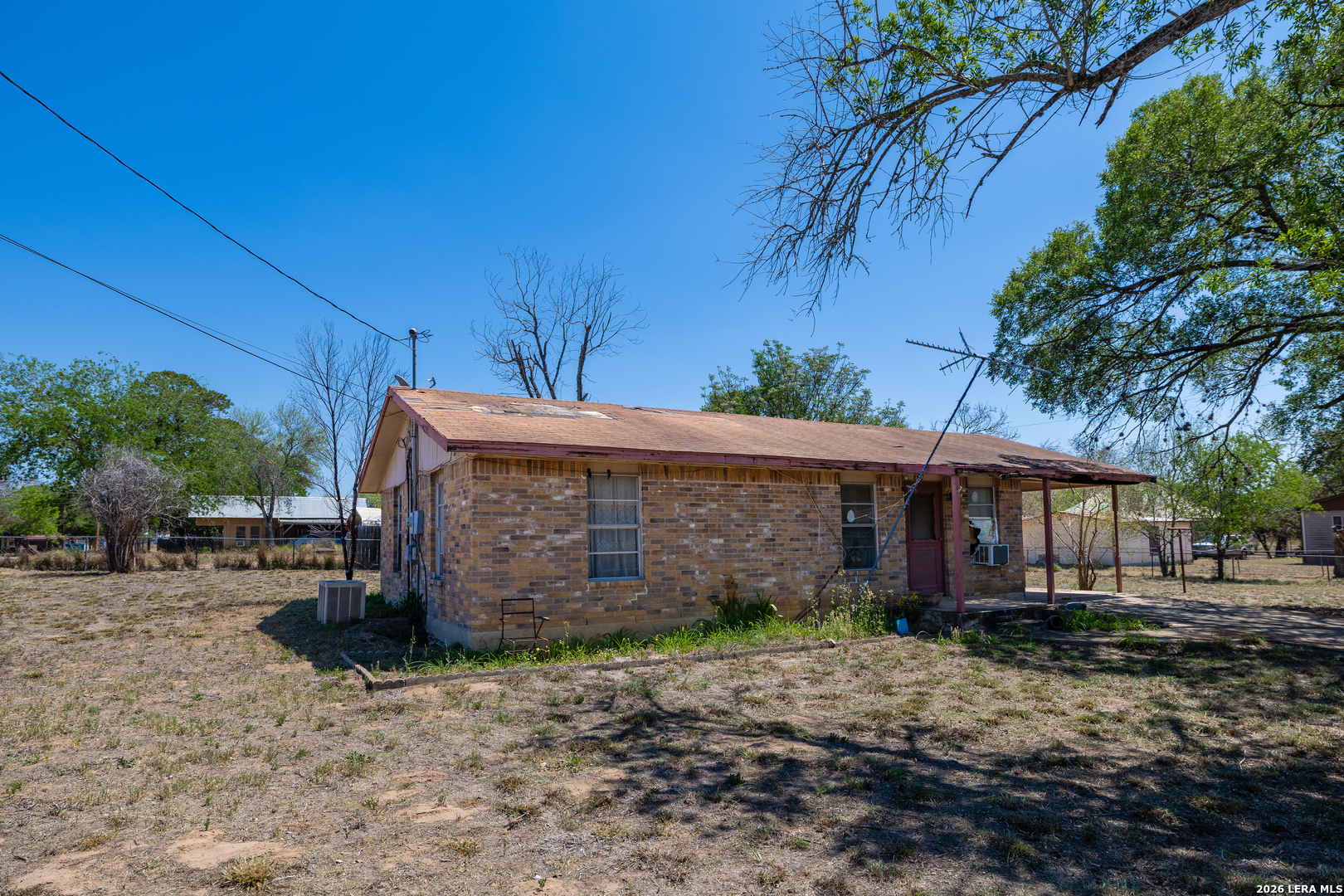 354 6th Poteet, TX 78065 - Photo 6 of 11 a front view of a house with garden