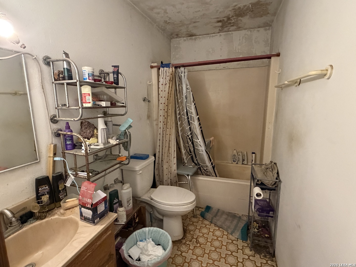 354 6th Poteet, TX 78065 - Photo 9 of 11 a bathroom with a toilet and a shower