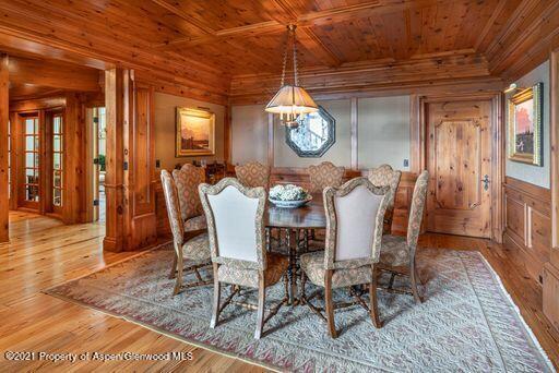 2137 Red Mountain Road Aspen, CO 81612 - Photo 17 of 59 a view of a dining room with furniture window and wooden floor