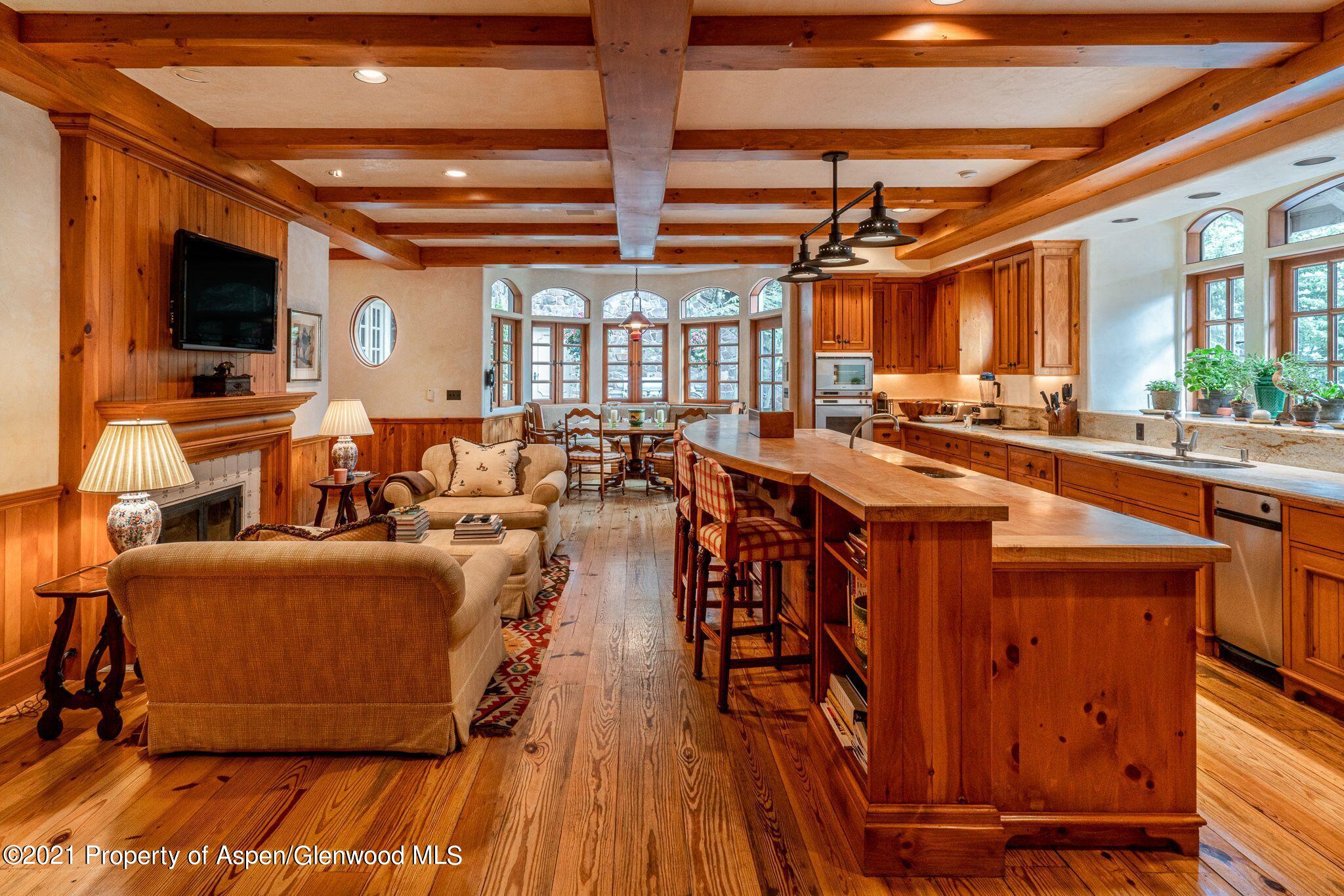 2137 Red Mountain Road Aspen, CO 81612 - Photo 20 of 59 a view of a dining room with furniture window and wooden floor