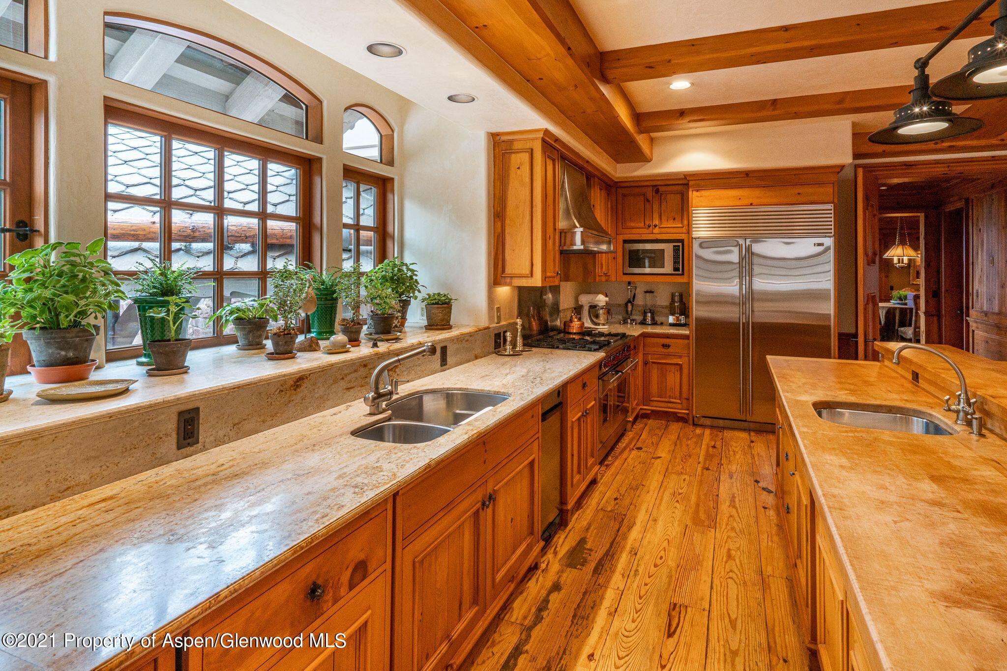2137 Red Mountain Road Aspen, CO 81612 - Photo 21 of 59 a view of a kitchen with a large window