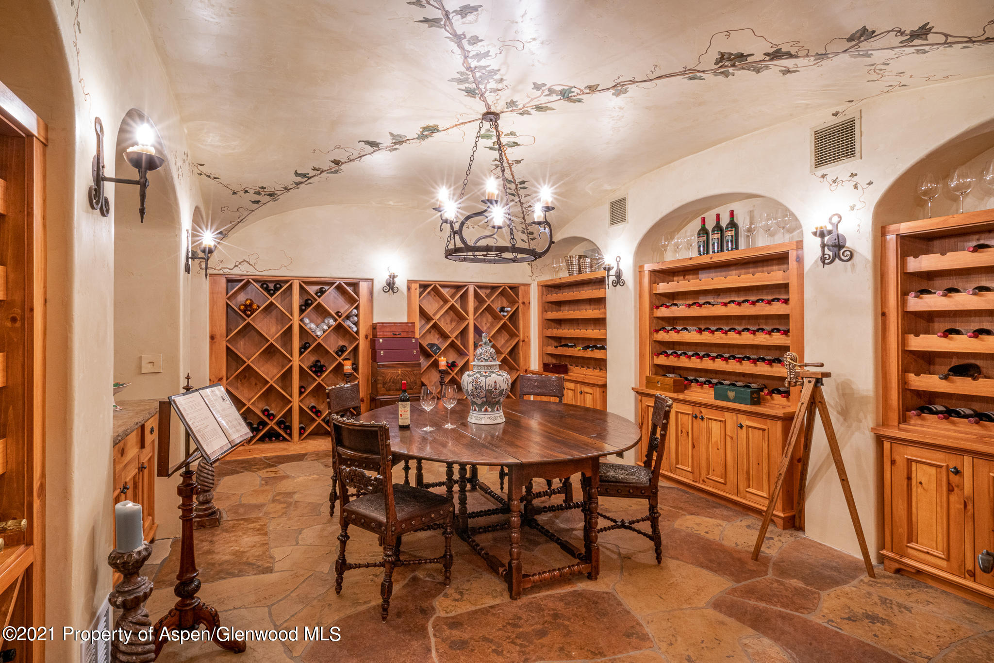 2137 Red Mountain Road Aspen, CO 81612 - Photo 26 of 59 a view of a dining room with furniture and chandelier