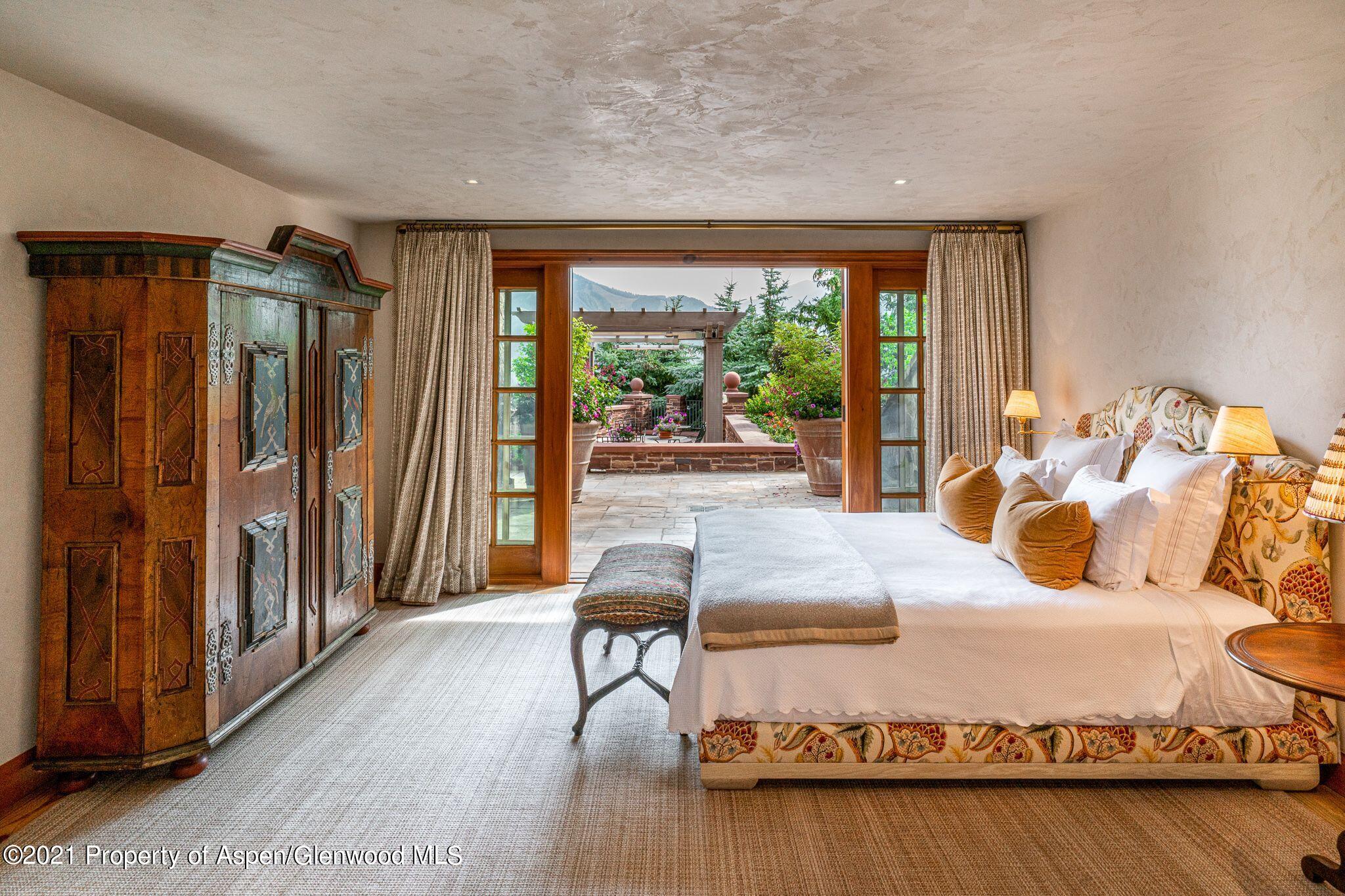 2137 Red Mountain Road Aspen, CO 81612 - Photo 37 of 59 a dining room with furniture and a floor to ceiling window
