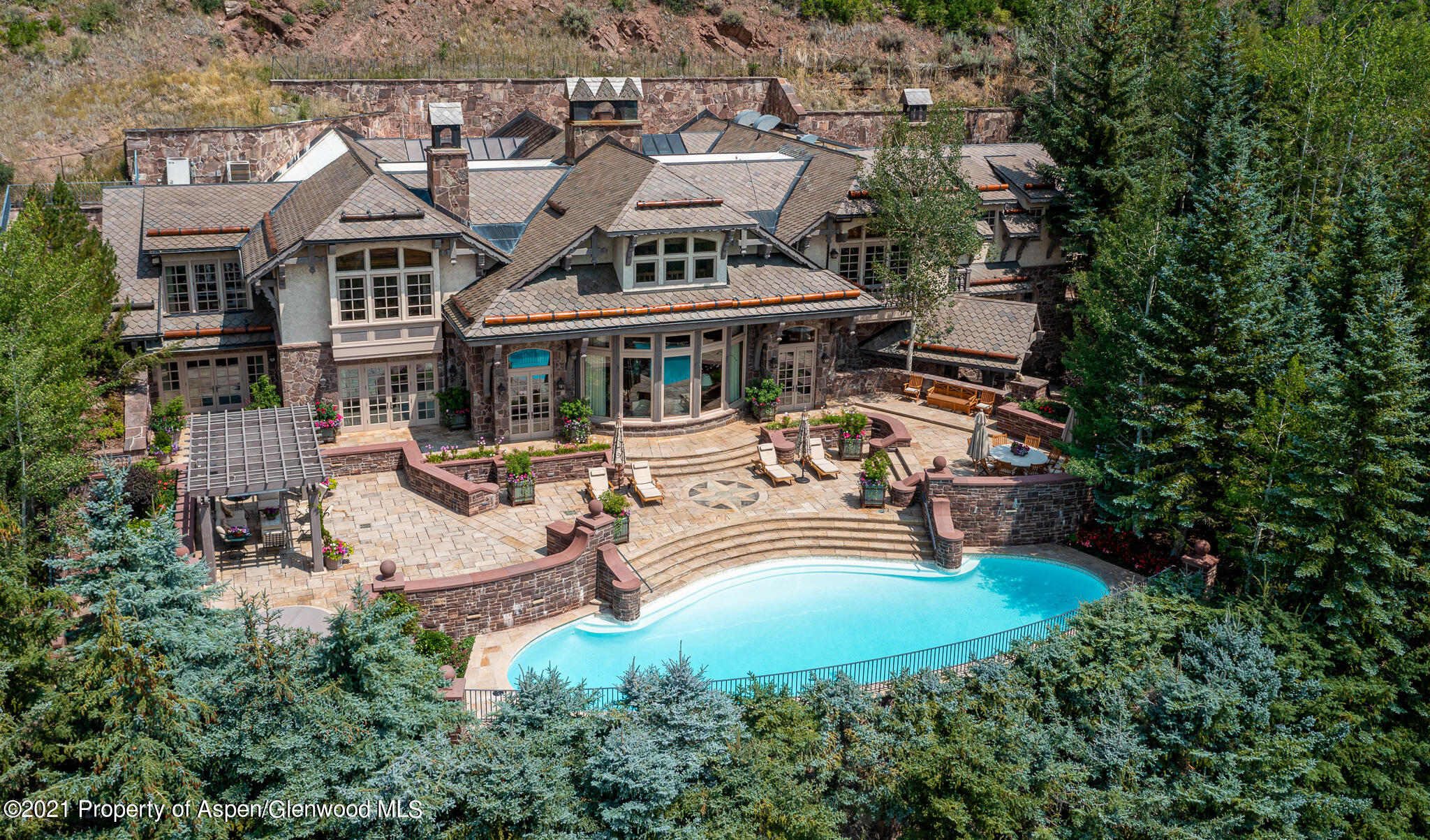 2137 Red Mountain Road Aspen, CO 81612 - Photo 54 of 59 an aerial view of a house with garden space and trees all around