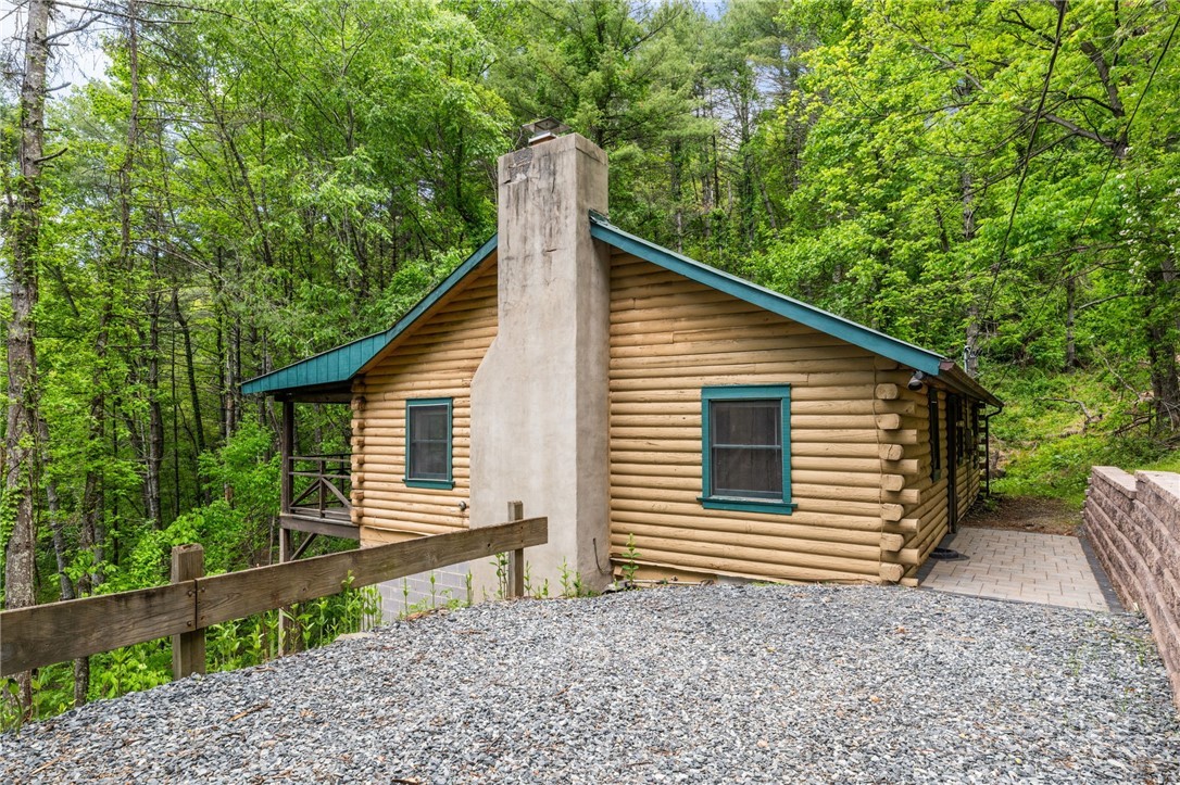 233 Alpine Acres Road Vilas, NC 28692 - Photo 2 of 32 a view of a house with a yard