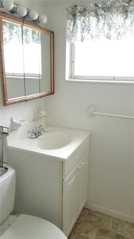 1801 Restful Drive, Unit N7 Bradenton, FL 34207 - Photo 18 of 24 a bathroom with a sink and a window